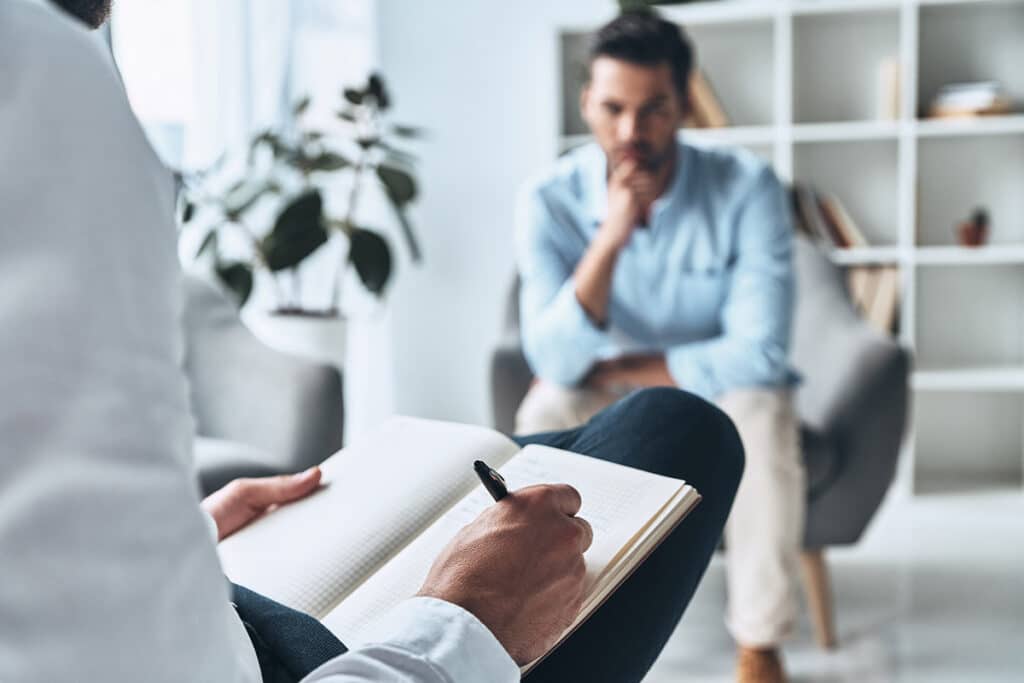 Man learning about the benefits of dialectical behavior therapy for addiction