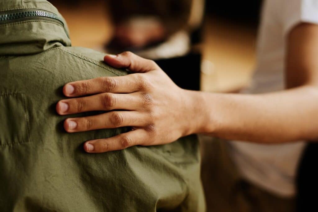 a person comforts another after learning about supporting someone with a mental illness